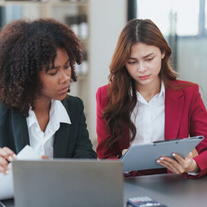 Two professionals working on a budget